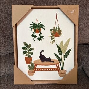 BP home embroidered wall hanging with plants and cat